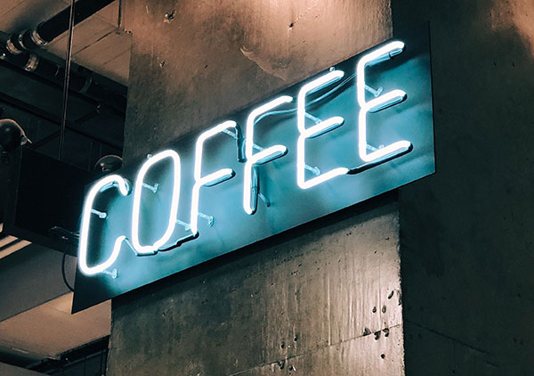A neon sign that says coffee